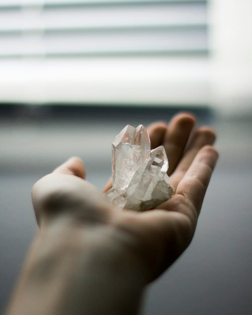 Hands holding rough gemstones