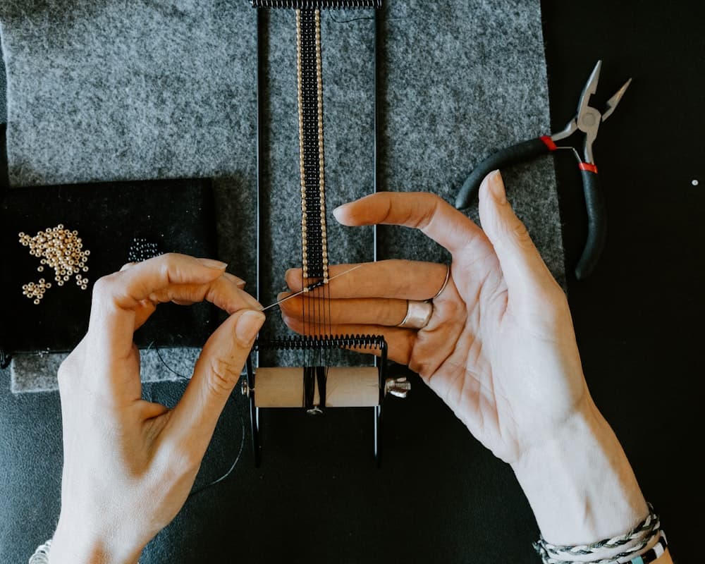 A maker working on a piece of jewelry